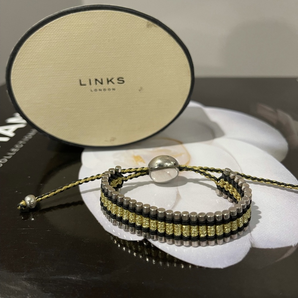 Links of London silver, gold and black bracelet